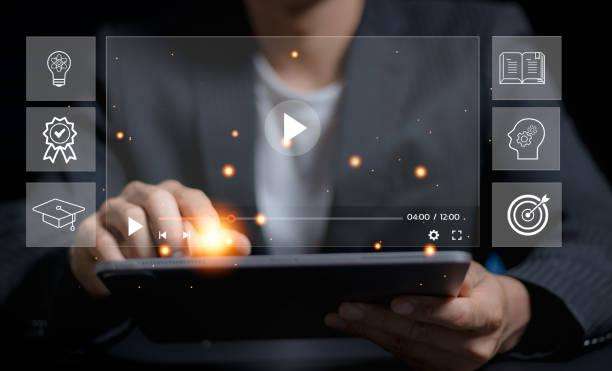 A guy in front of a computer showing the benefits of video marketing.