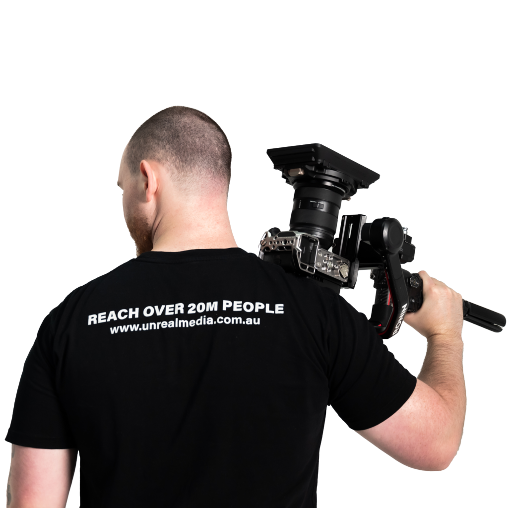 Jakob holding a camera about to do video marketing in Perth.