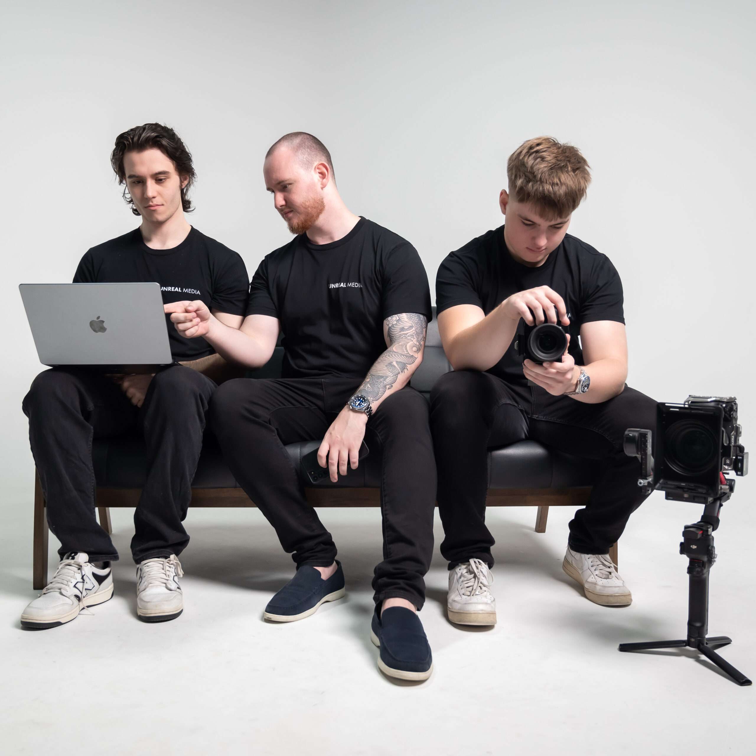 Men collaborating behind the scenes with equipment