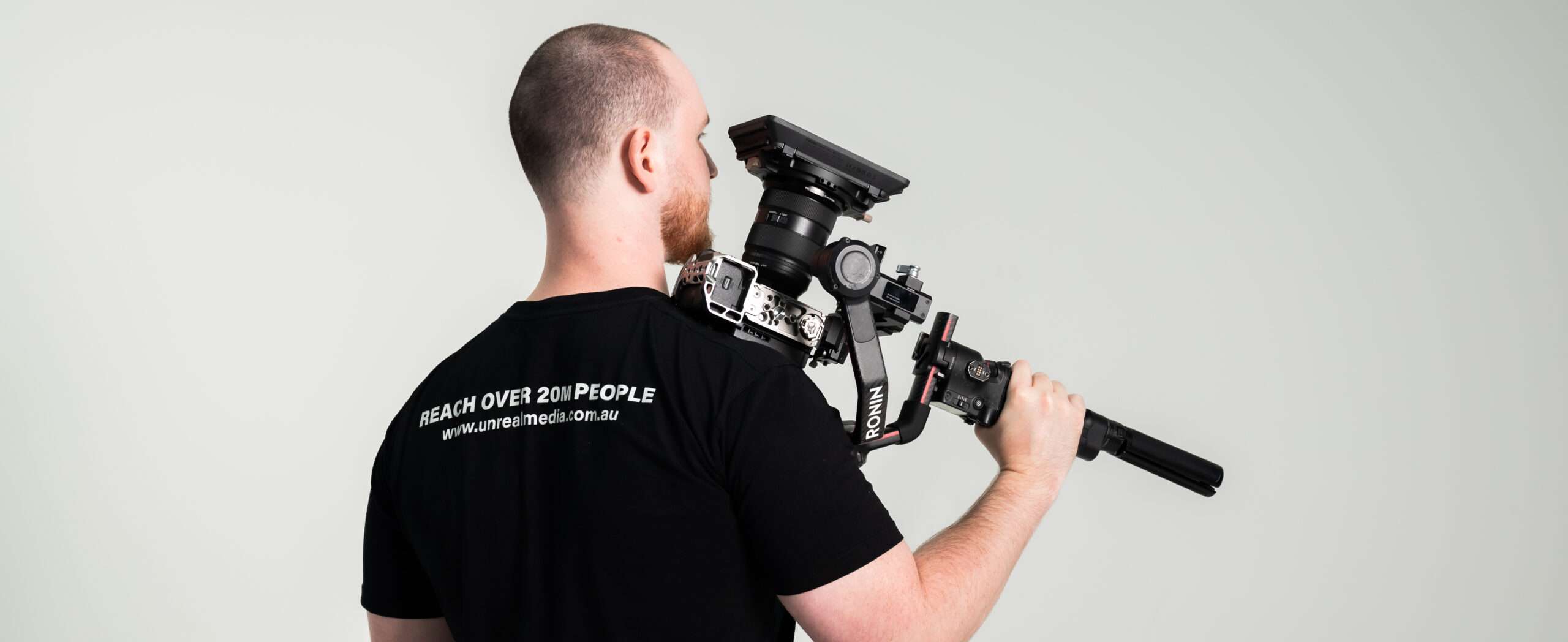 Man with professional video camera equipment.